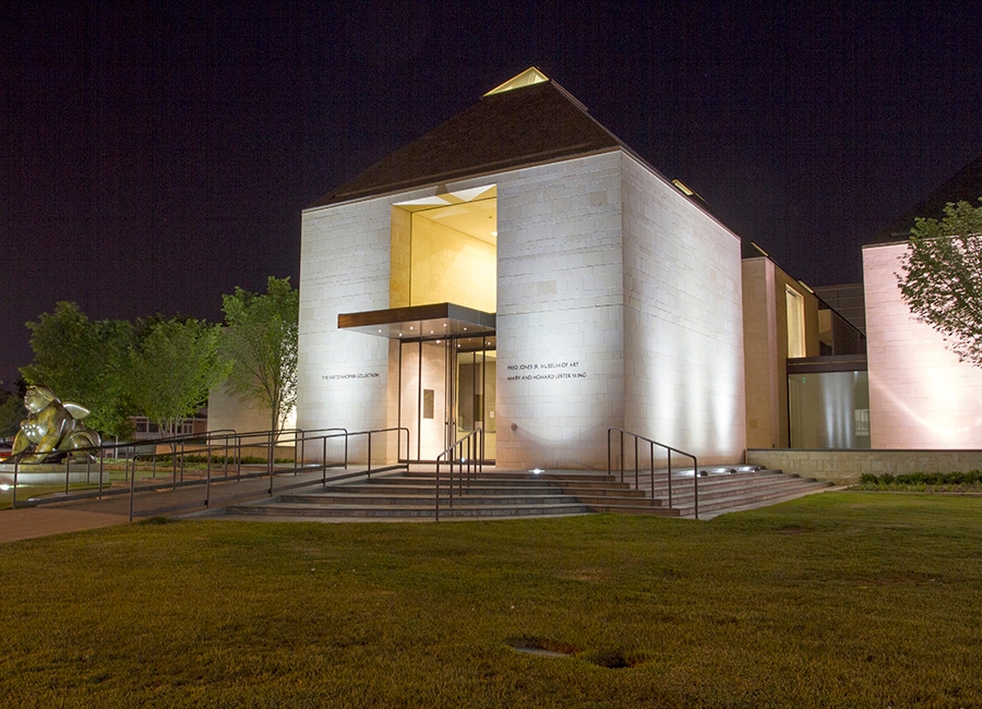 Fred Jones Jr. Museum of Art building at night.