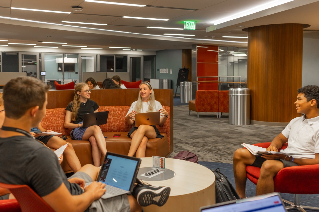 Group of students working in library 