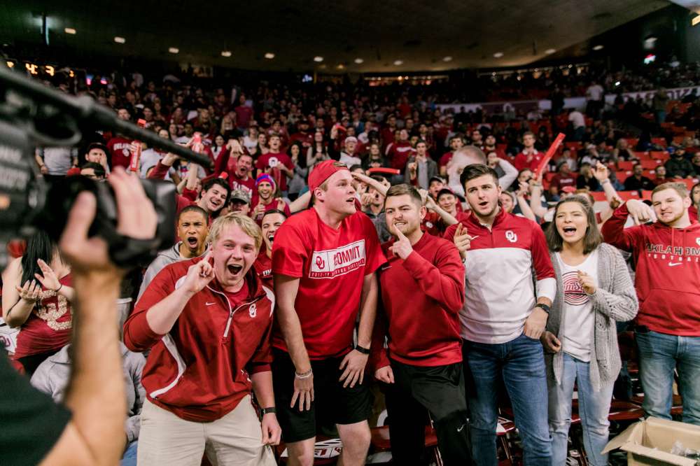 The student section sets the tone for an exciting basketball game at the Lloyd Noble Center.