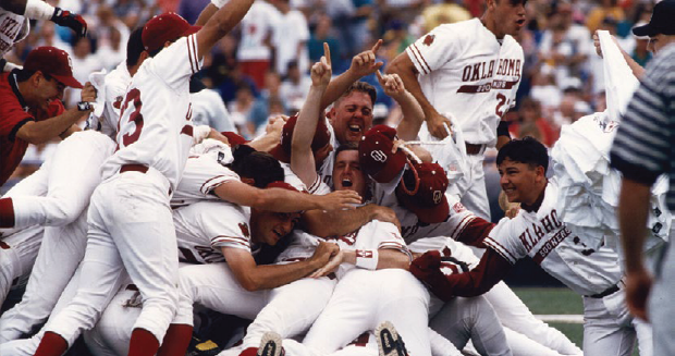 A color photograph of the OU baseball team celebrating.