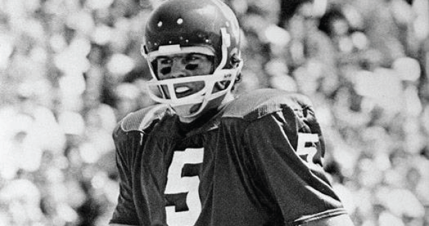 A black and white photograph of an OU football player with the number 5 on his jersey.
