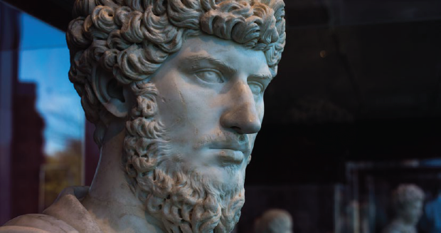 A bust of a man with curly hair and a beard.