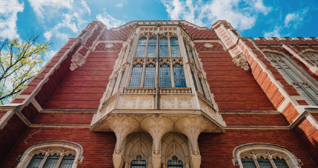 A photograph of a building on the University of Oklahoma campus, looking up from the ground.