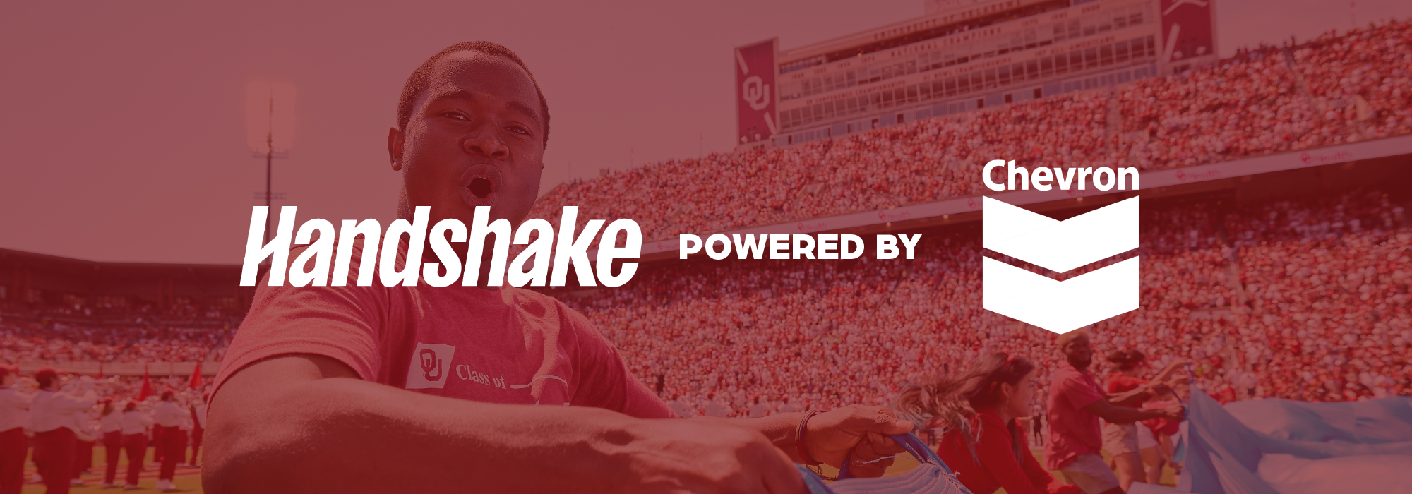 Handshake powered by Chevon words in white, overlaying a crimson image.