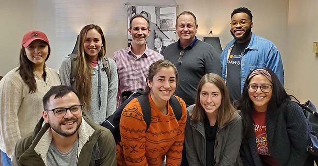 Professor Mike Crespin and 2019 community scholar students with Norman City Manager Darrel Pyle photo of 2019 community scholars class