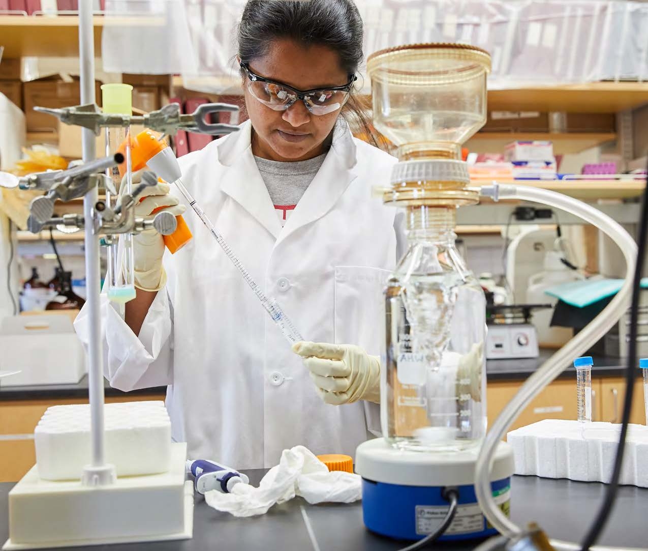 Student pipetting in a lab