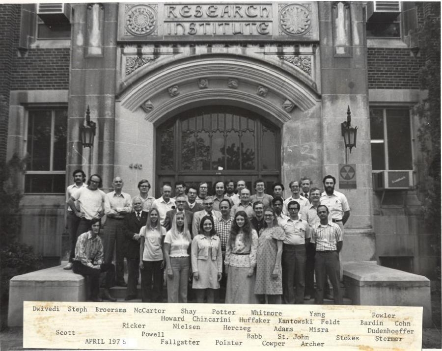1974-1975 group photo in black and white. Text under photo: "[First line] Dwivedi, Steph, Broersma, McCarter, Shay, Potter, Whitmore, Yang, Fowler, [Second line] Howard, Chincarini, Huffaker, Kantowski, Feldt, Bardin, Cohn, [Third line] Ricker, Nielsen, Herczeg, Adams, Misra, Dudenhoeffer, [Fourth line] Scott, Powell, Babb, St. John, Stokes, Stermer, [Fifth line] April 1975, Fallgatter, Pointer, Cowper, Archer."