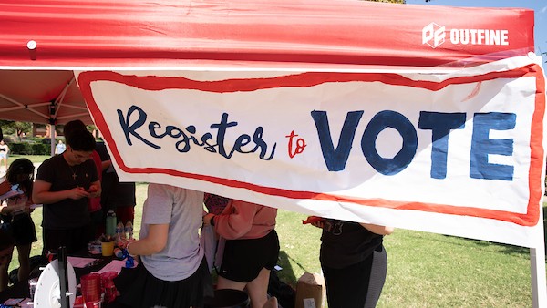 Register to vote sign.