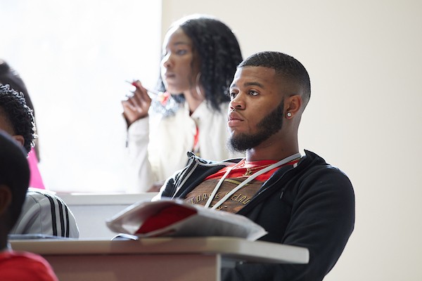 Student facing forward in a classroom.