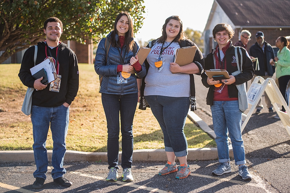 Dr. Shortle with OU students at a polling station.