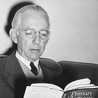 Professor Ewing reading a book.