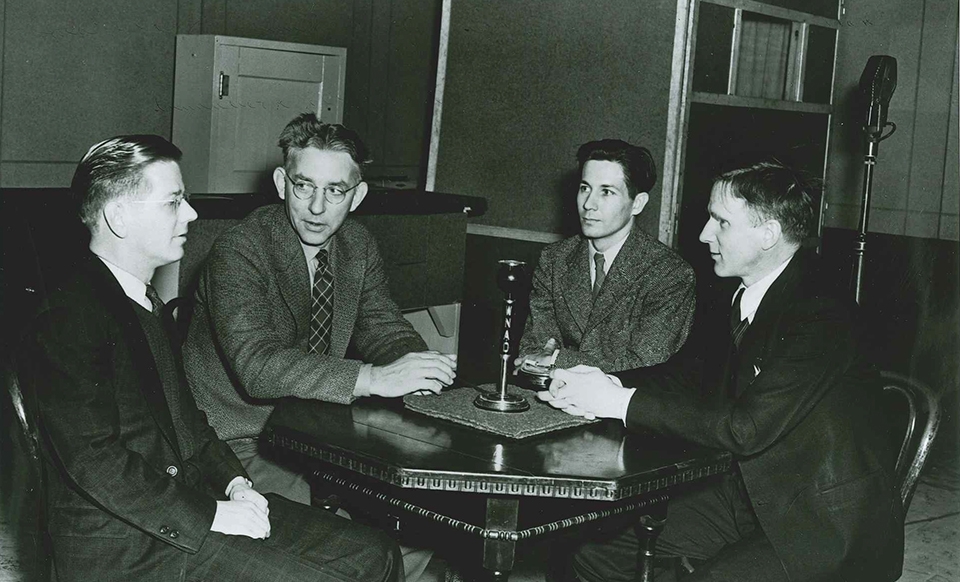 Professor Ewing giving an interview with other individuals on WNAO.
