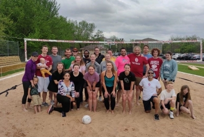 Volleyball Event Group photo of psychology graduate students, faculty, and friends playing volleyball