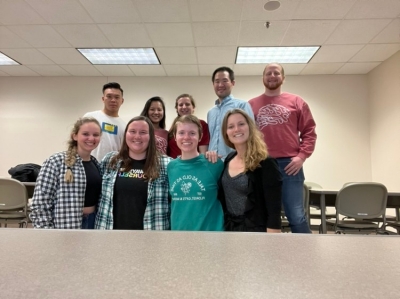 group photo of graduate students after the research spark event