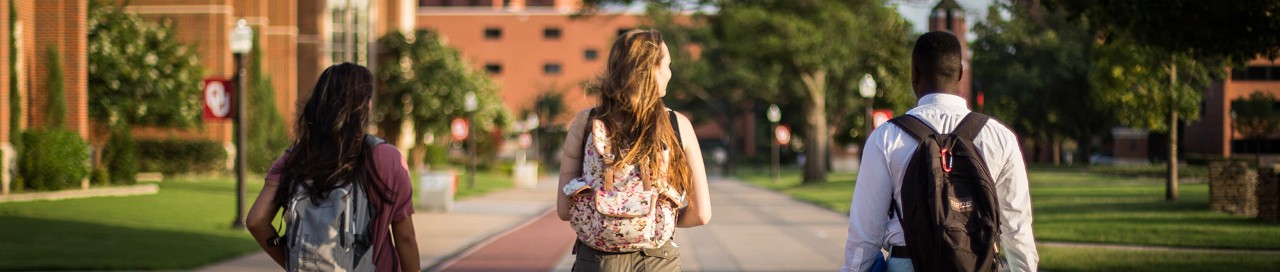 Three students walking on the University of Oklahoma campus in Norman.