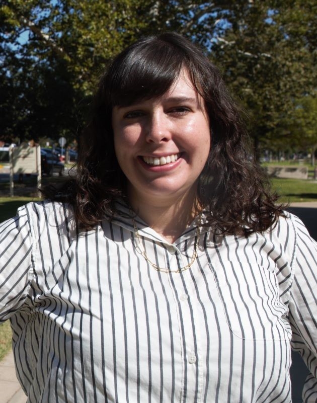 Claire Miller in a white striped shirt