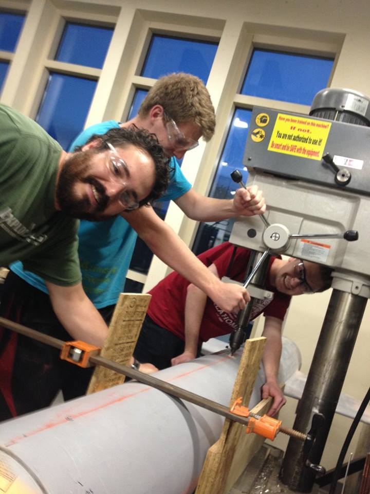 Students working with machinery