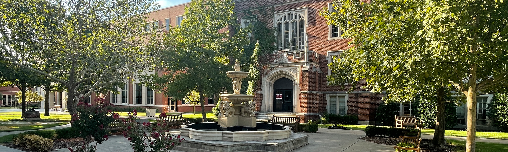 Felgar Hall with green trees and sunlight