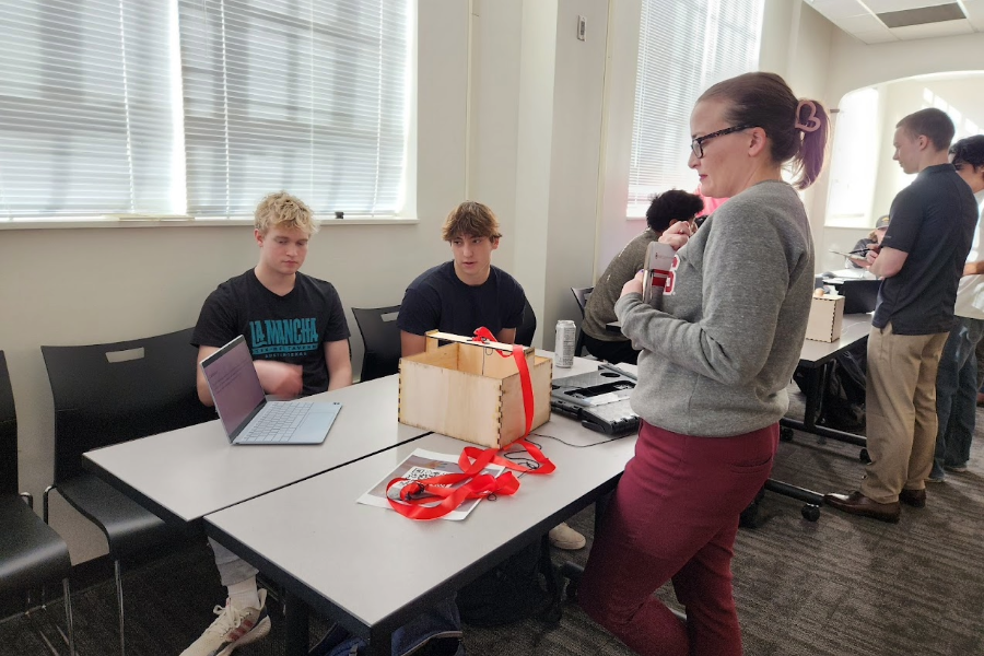 Students and EP Faculty member Dr. Harvey discussing a project