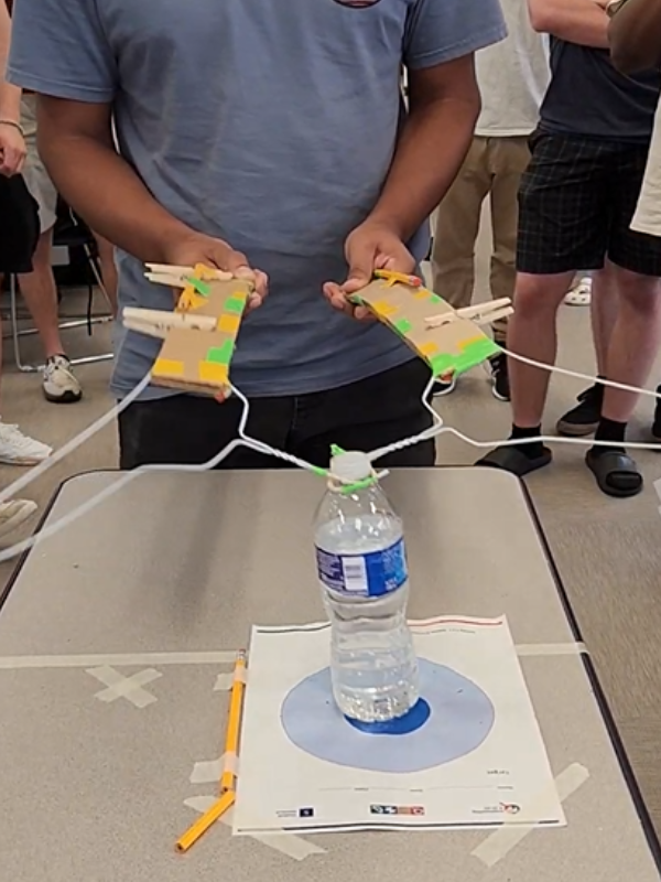 A student using a different example of the robot arm project