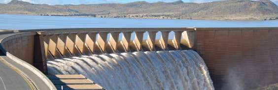 Water flowing through dam Water flowing through dam