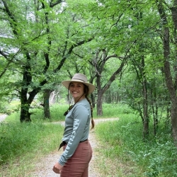 Hailey Seago stands in the forest