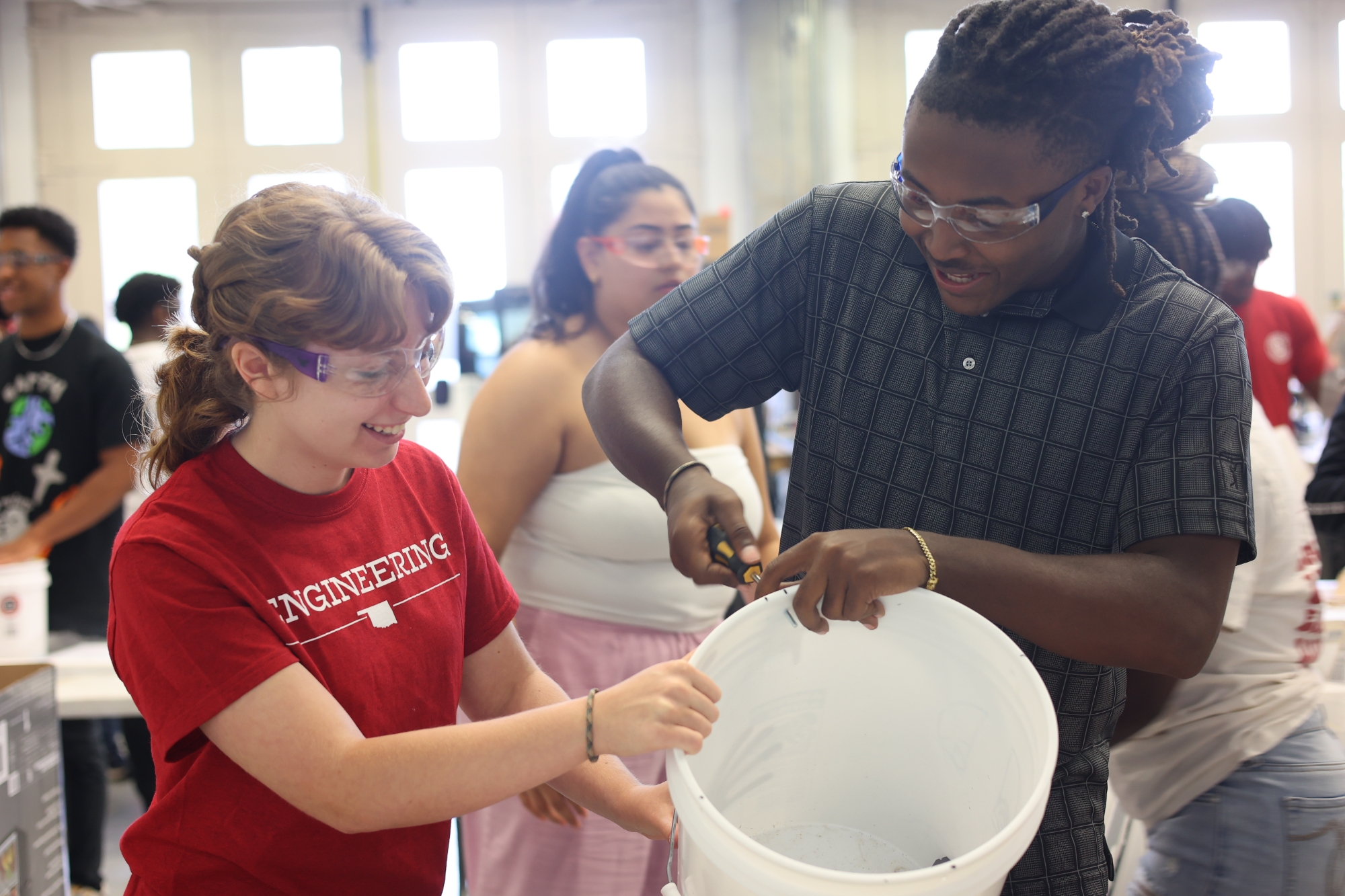 Students working in engineering bay during Summer Bridge.