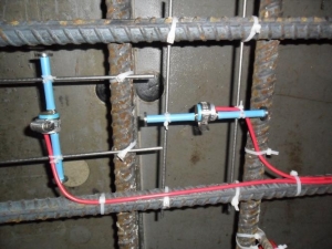 Vibrating wire strain gauges used in the field monitoring of shrinkage