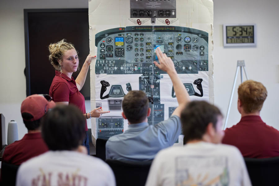 O U aviation students attend a lecture.