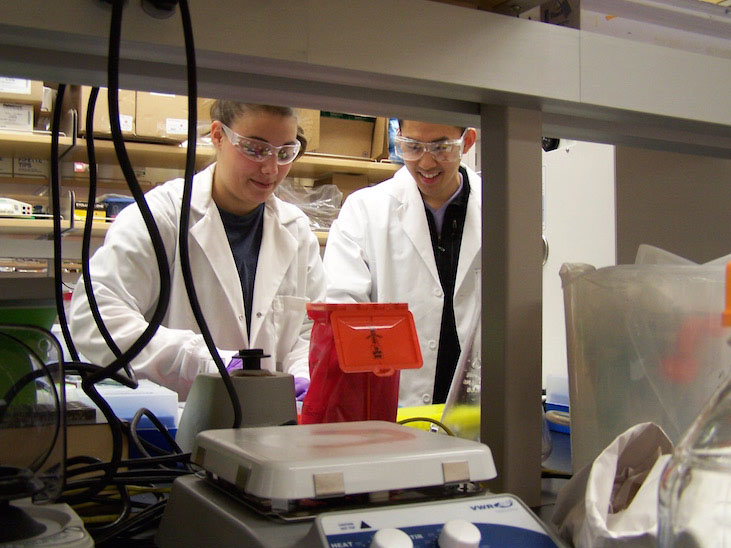 Two students working in a lab