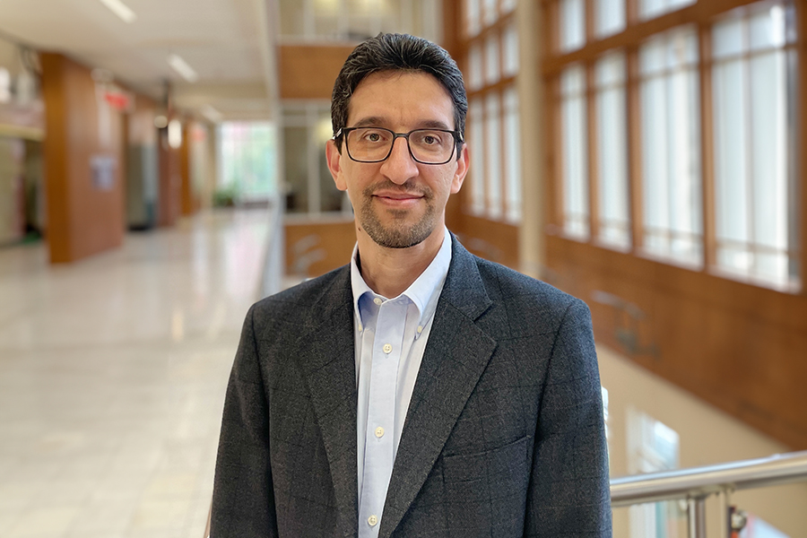 Pejman Kazempoor stands in front of Felgar Hall