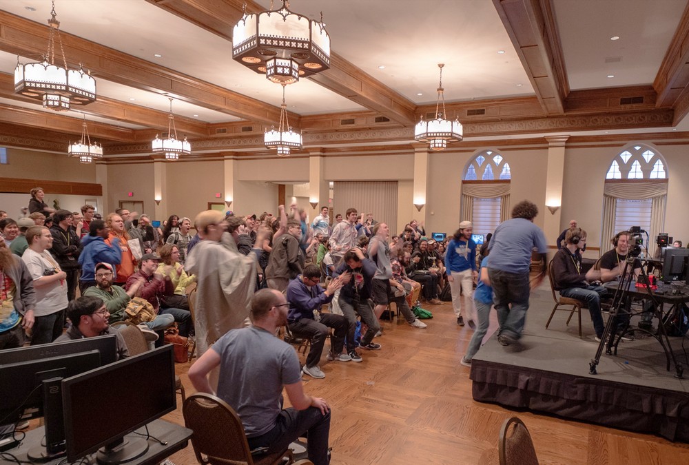 Esport tournament attendees cheering in the OU Memorial Ballroom.