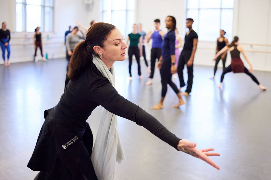 OU dance professor instructing students.