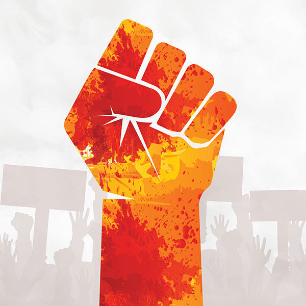 Powerful fist with picket line in the background.