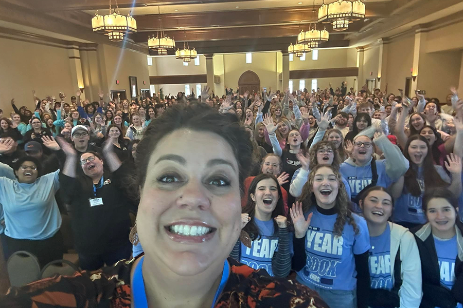 Melanie Wilderman taking a selfie in front of students