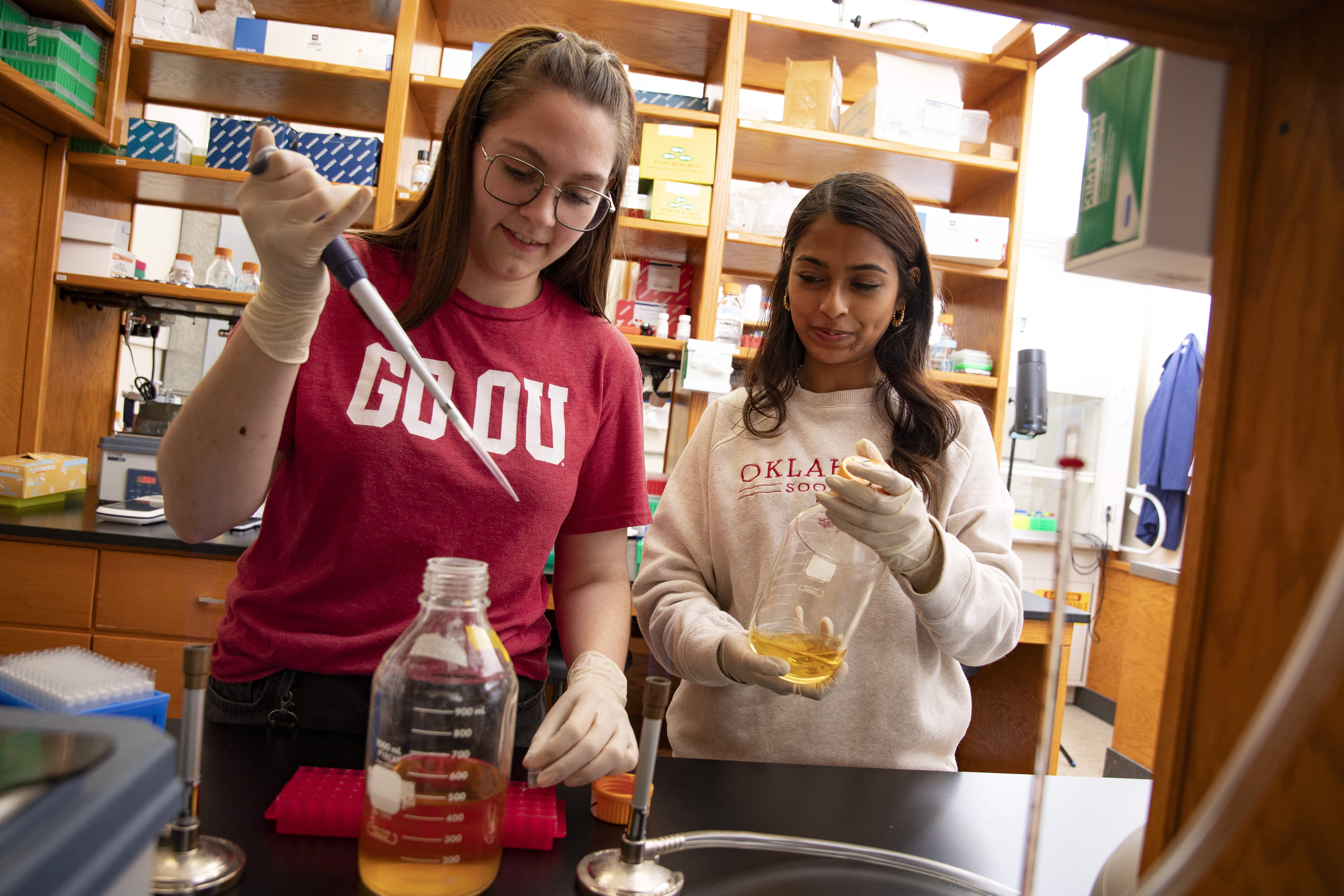 Two students in a research lab.