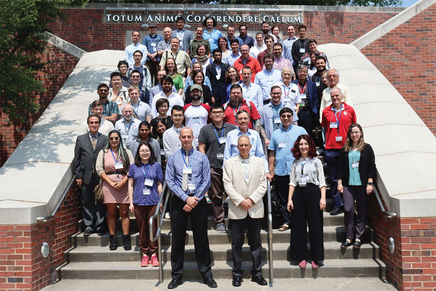 Attendees at the International Precipitation Conference standing outdoors on the steps of a building on 俄克拉荷马大学 Norman campus