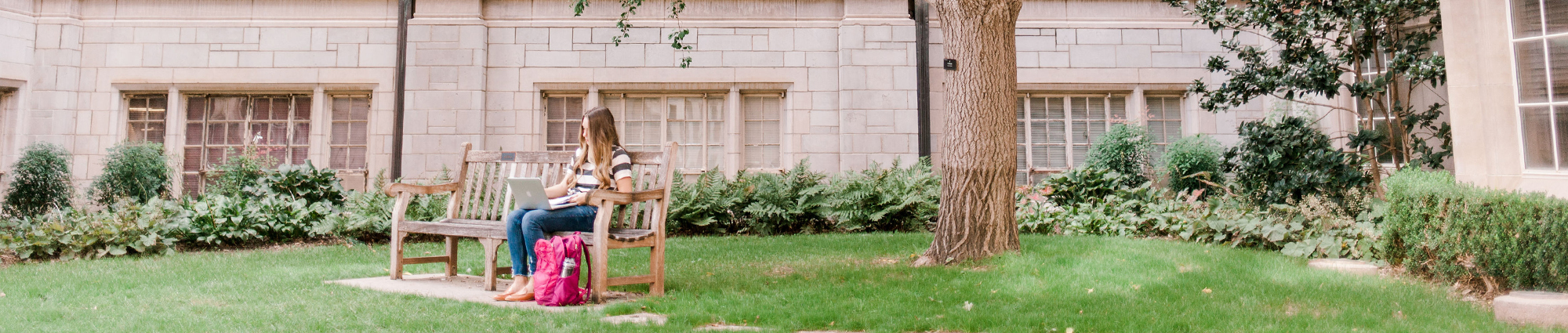 student sitting on bench