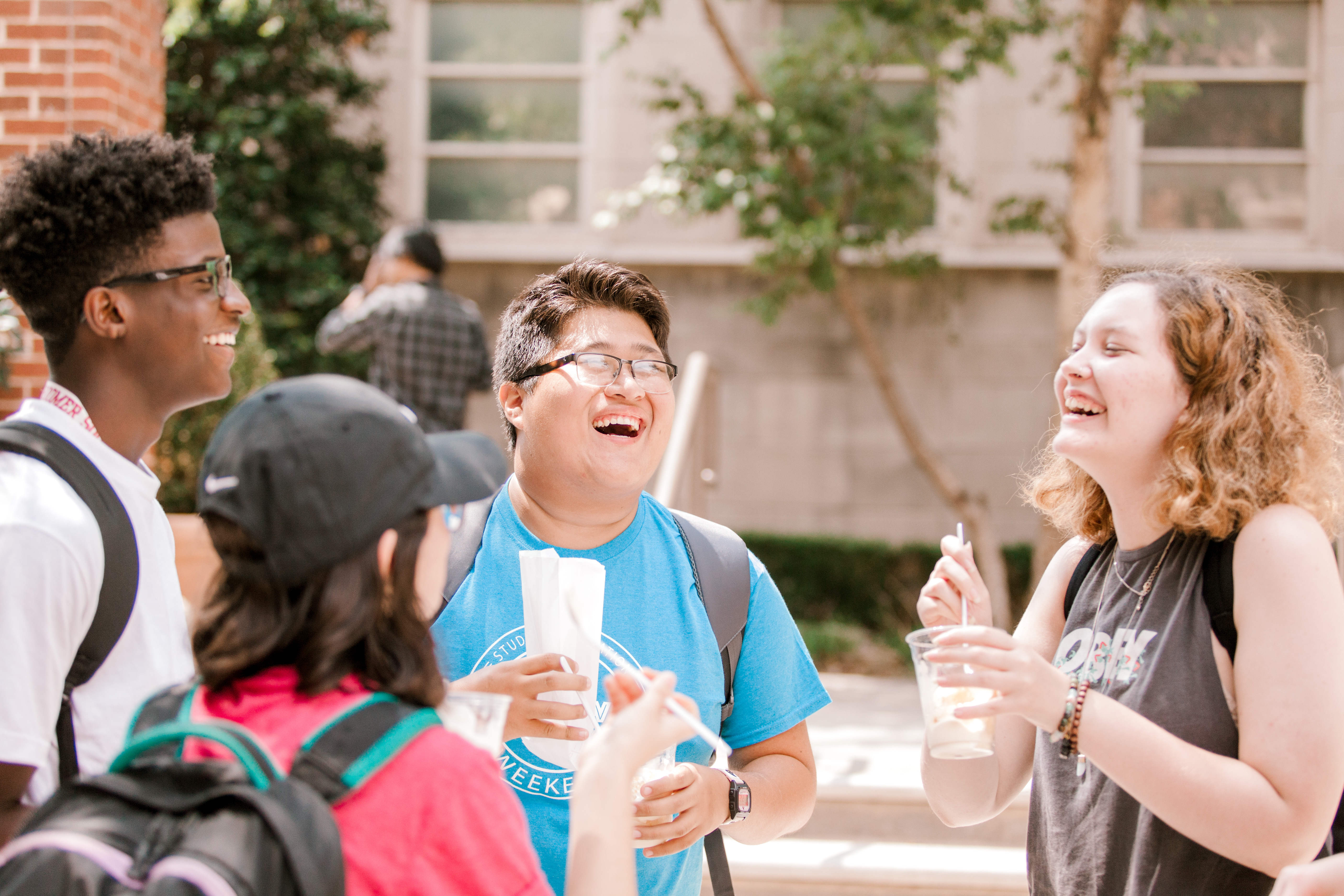 A group of students talking outside.