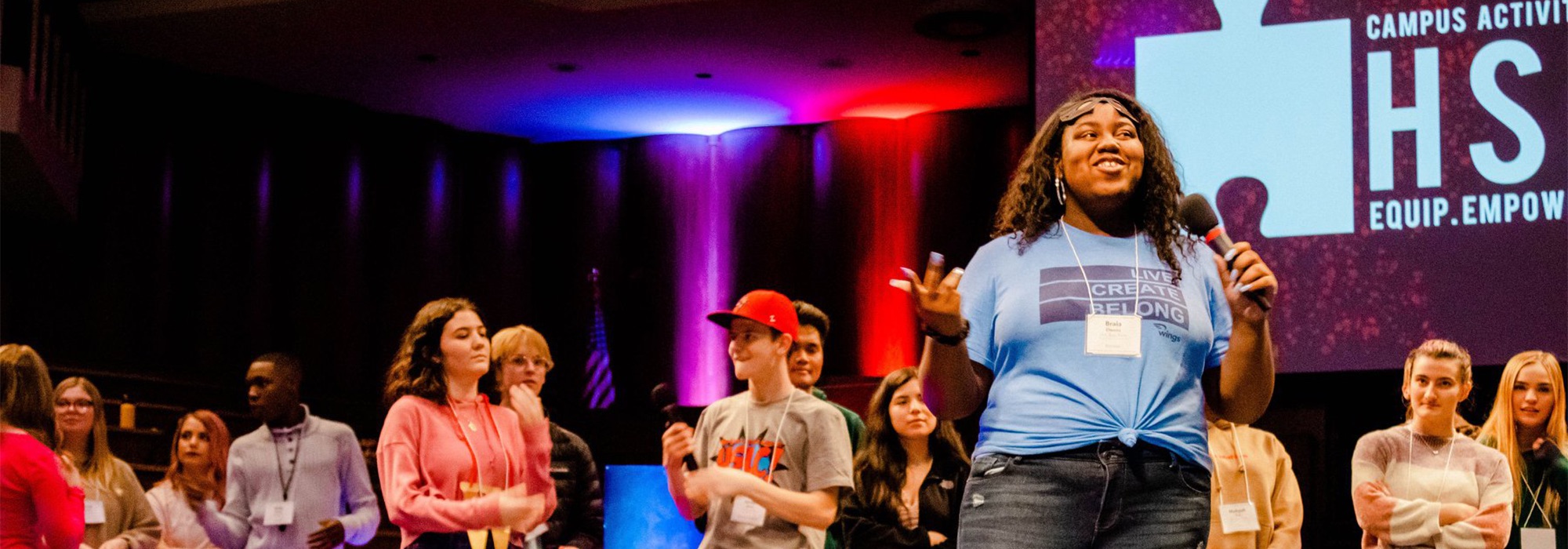 Students on stage during HSLC event.