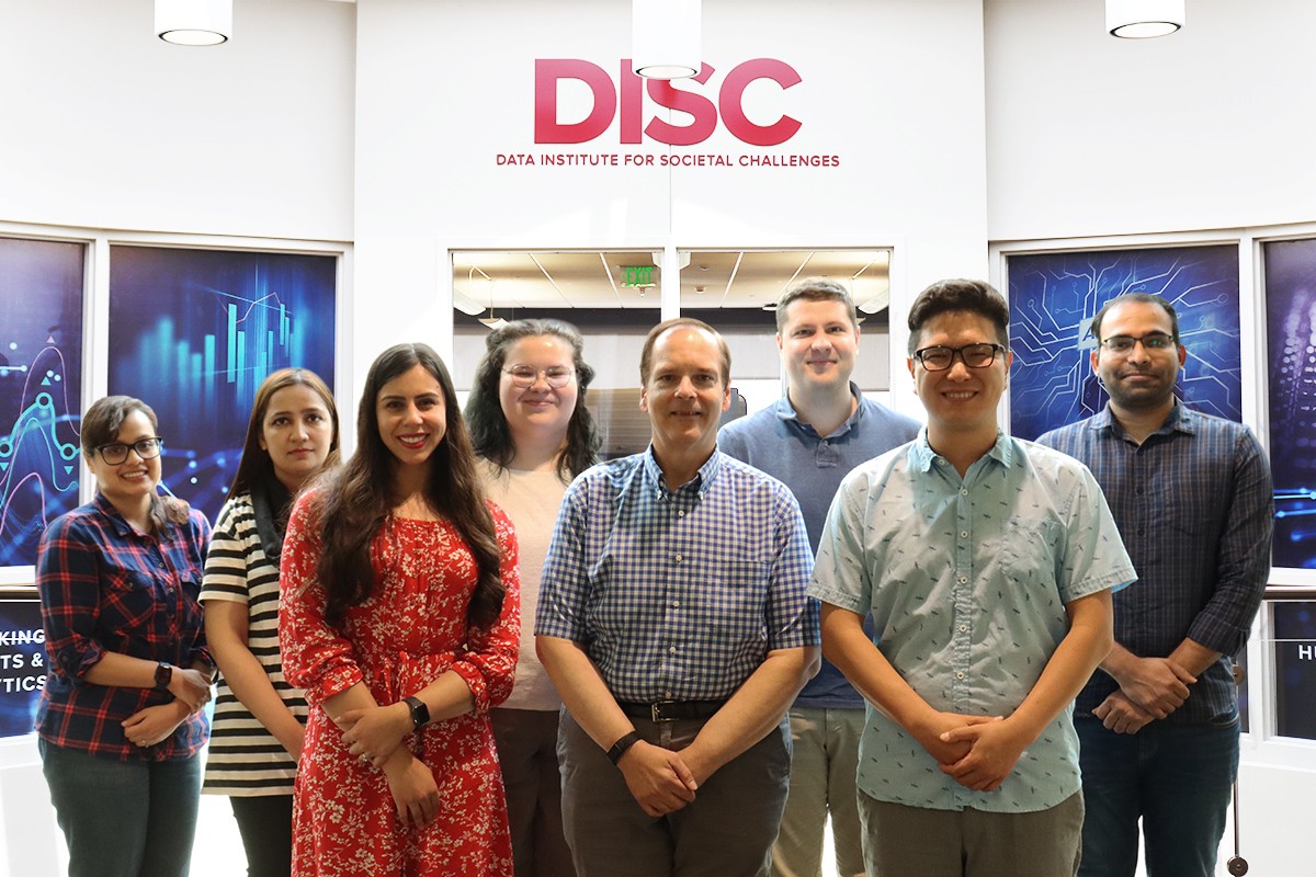 Sungahn Ko, Ph.D., (right front) alongside DISC staff and students