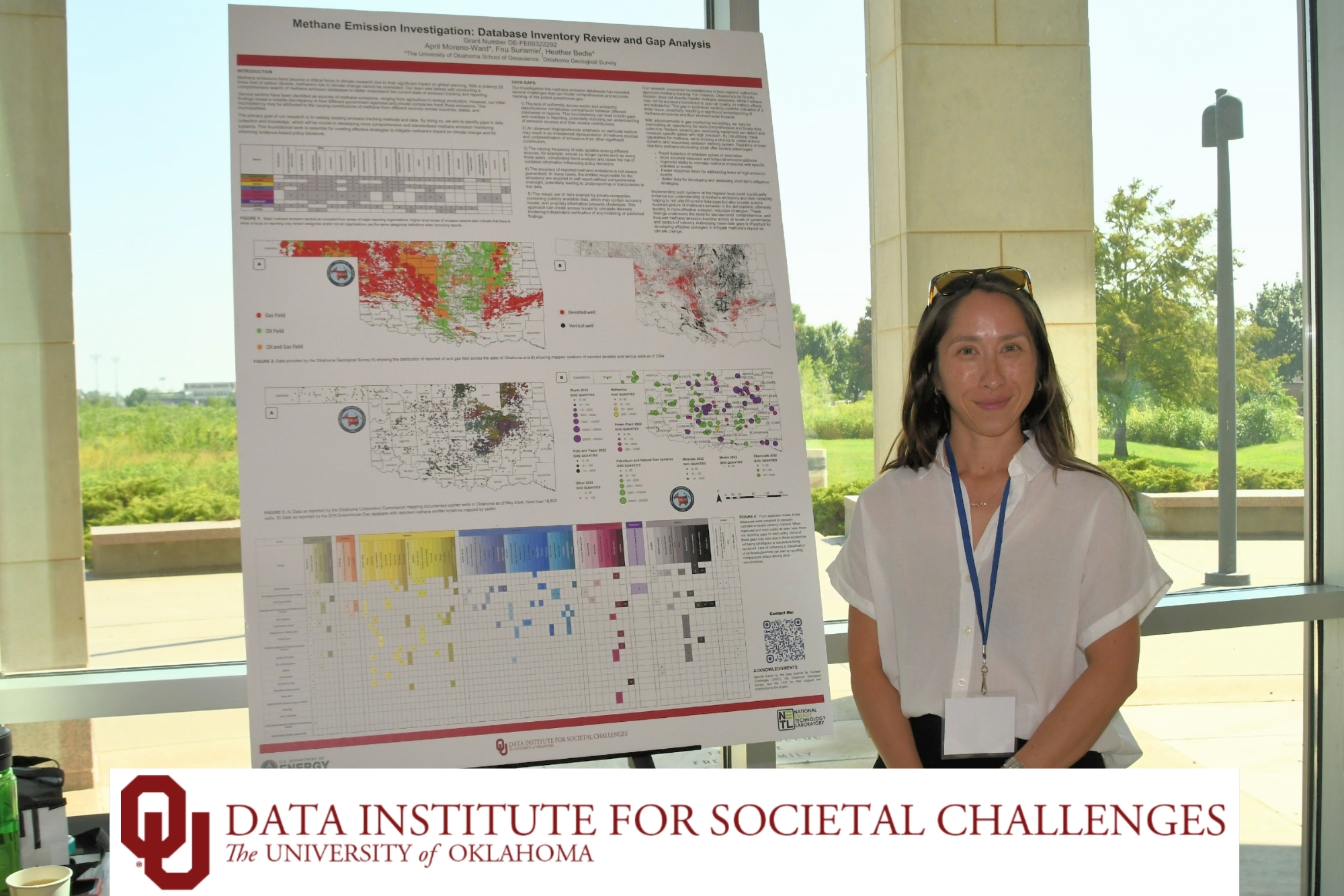 April Moreno-Ward next to the 1st place poster