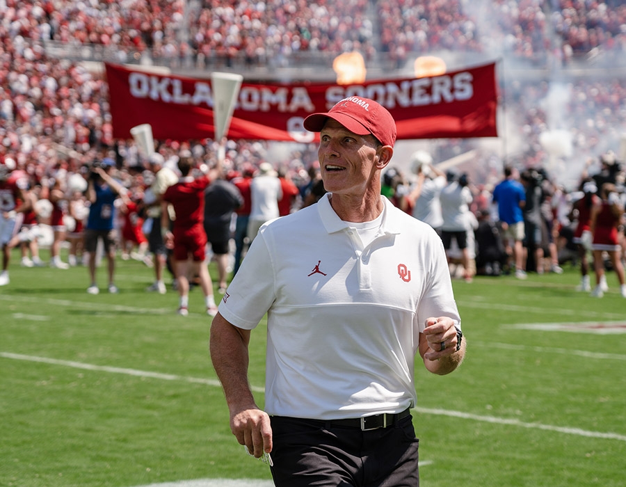 Brent Venables on the football field during the UTEP football game.