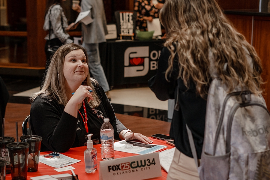 People talking during Gaylord College Career Fair