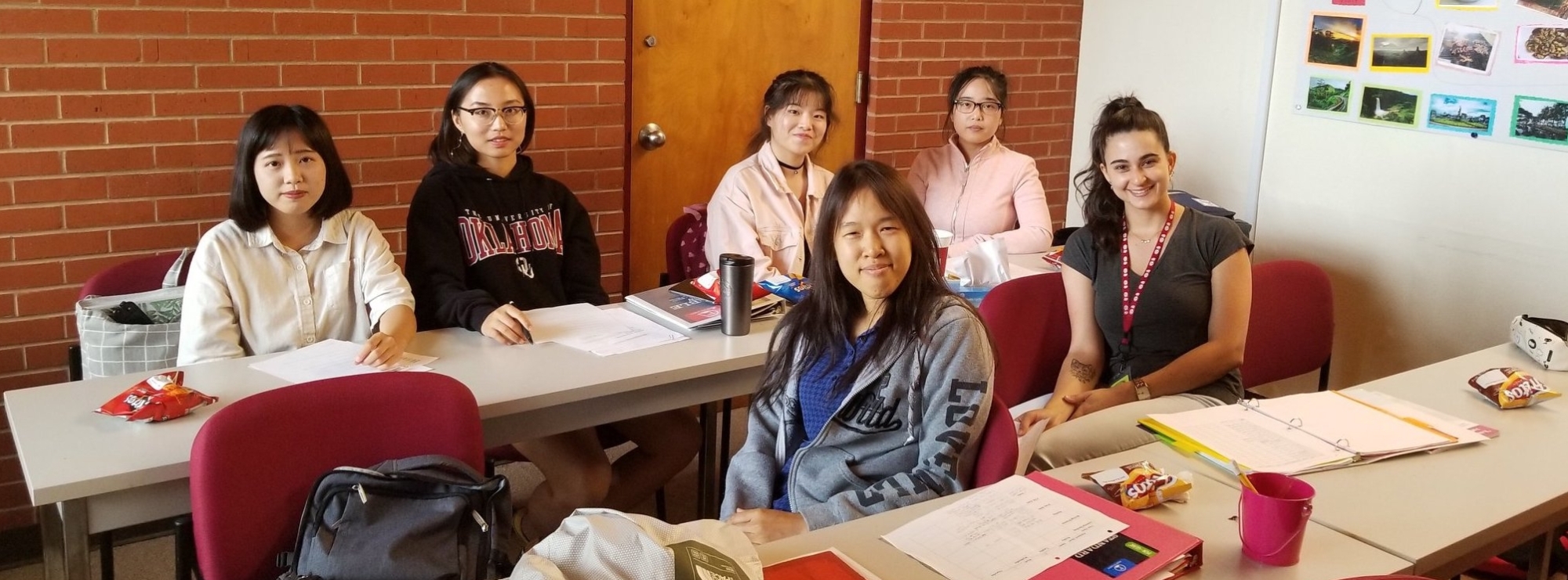 A group of CESL students sitting at tables.
