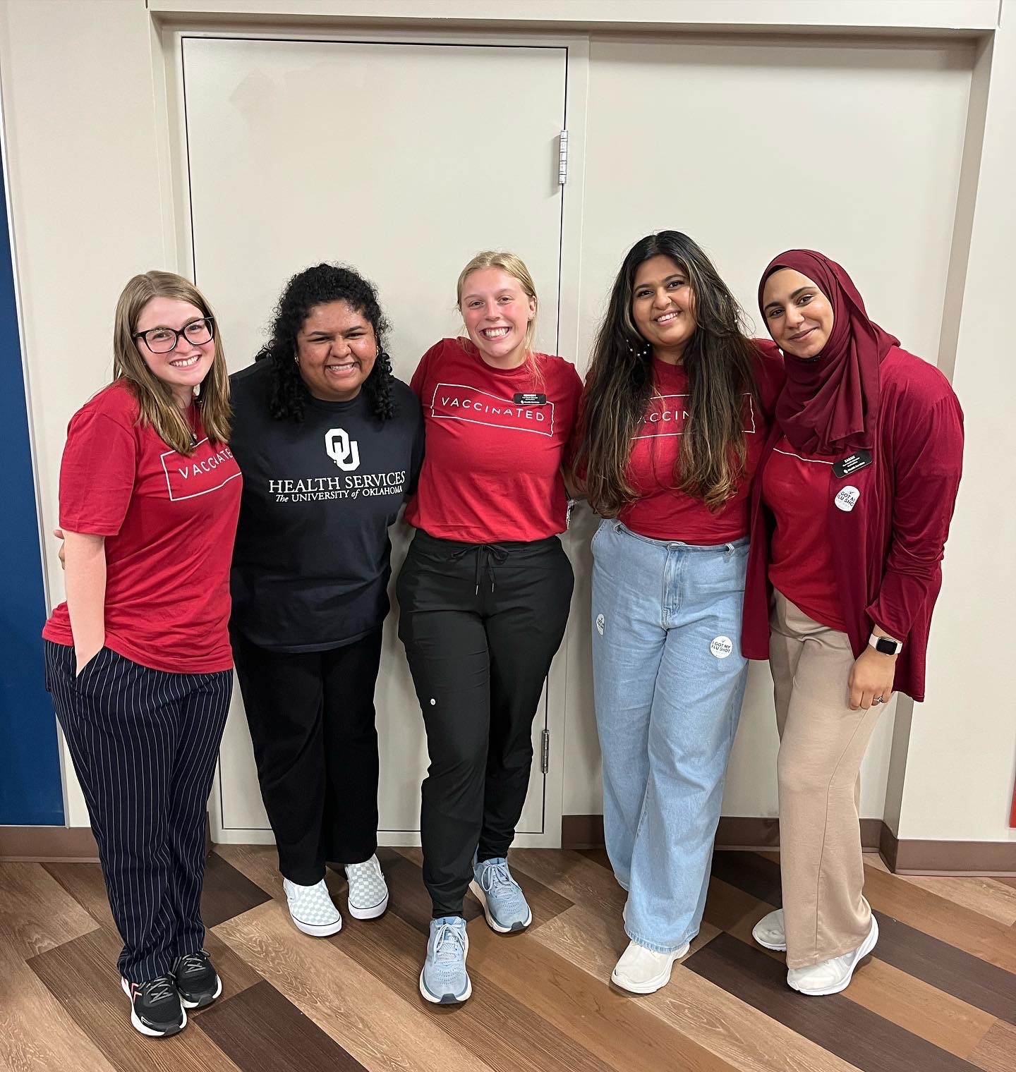 five female peer health educators at annual flu shot clinic