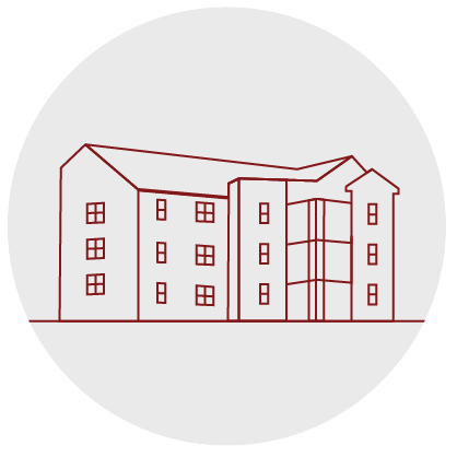 Grey circle with an exterior lined image of the front of a Traditions Square building