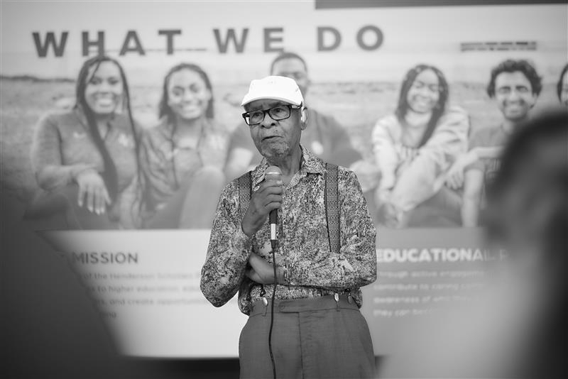 Dr. George Henderson speaking at a HSP welcome event. 