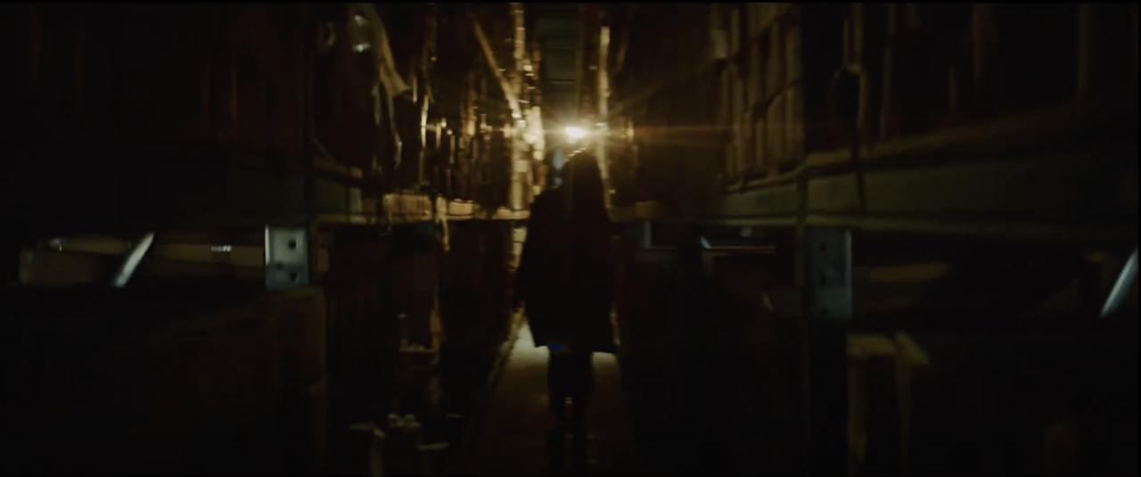 Karelia walking through OPIC's warehouse.