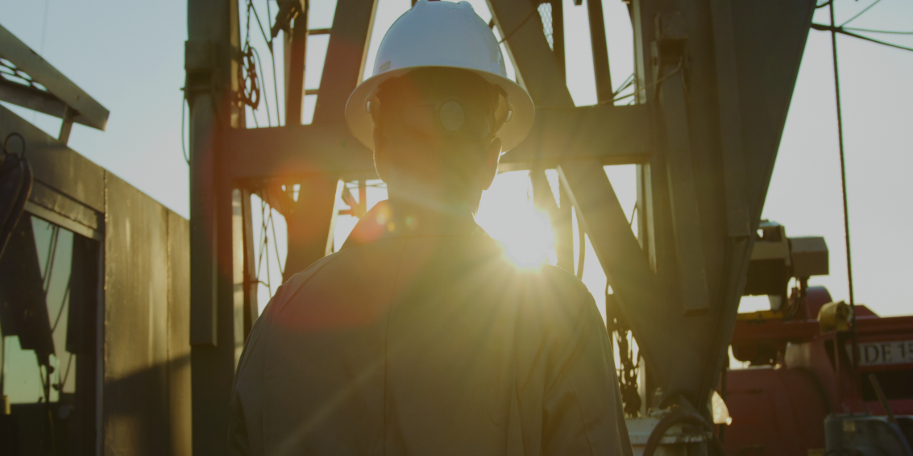 Payton is at a well site at sunrise.